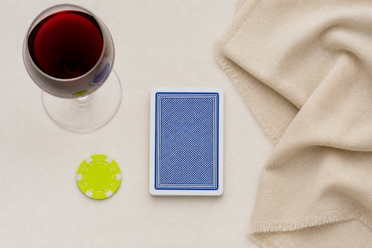 Bone review card, cobalt edge, lime chip: wine plus extra sedation cloth